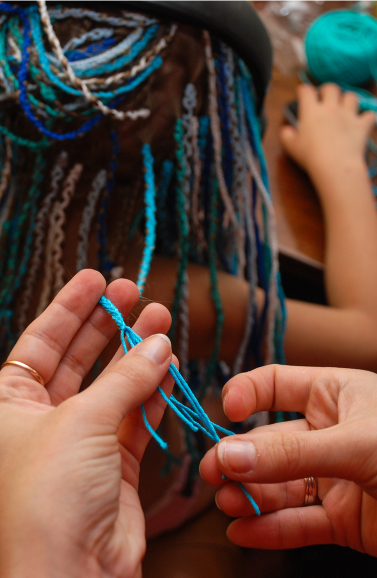 Remember hair wraps? I don't mean using a scarf to craft an updo. I mean boho-summer-chic hair wraps from those summer vacations you went on as a teenager. The ones where you wrap thread around a lock of hair in varying patterns and colors to create a look that's unique to you. It's time for them to make a comeback! You will love having one this summer! 