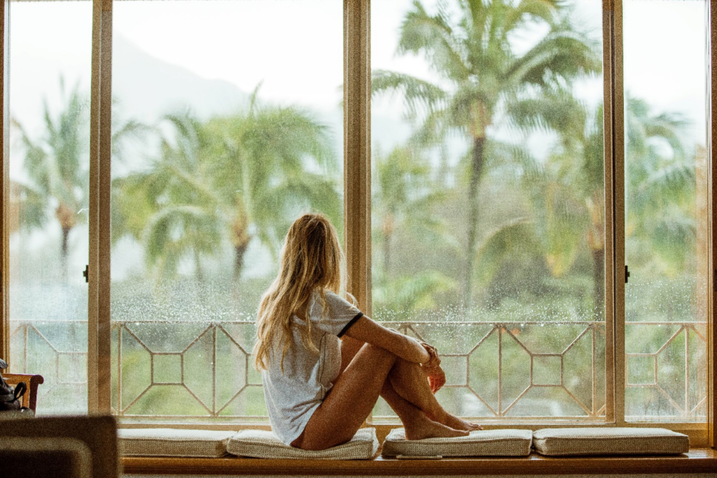 A woman sitting on a DIY window seat